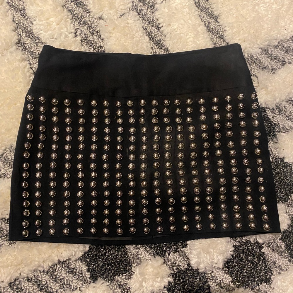Black mini skirt with round metal studs…